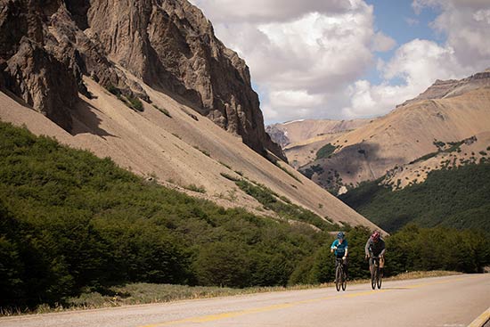 Photo of two people riding bikes along the Austral Highway in Patagonia, Chile