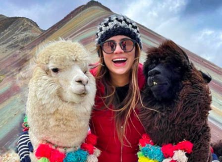 Photo of a woman with llamas in Peru