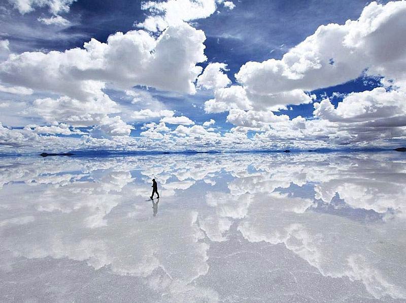 Photo of person walking on salt flats in San Pedro de Atacama